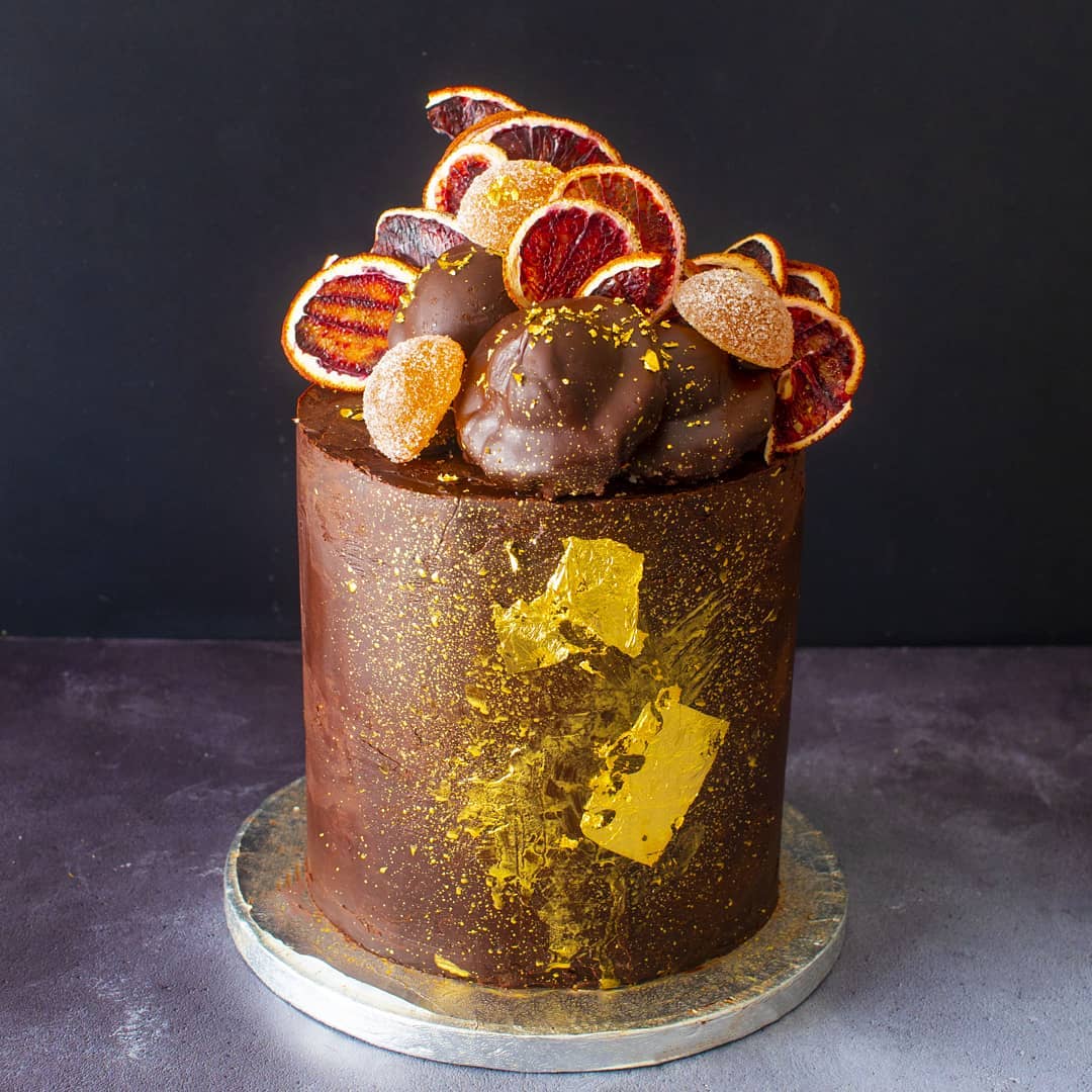 Instagram chocolate cake with fruit and gold decoration